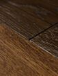 Dark brown wood flooring close up