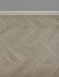 Grey herringbone laminate floor with grey walls